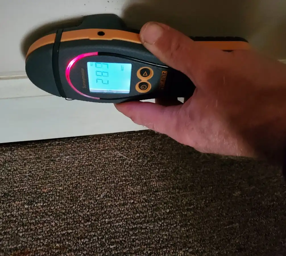 Moisture detection at baseboard during Storm Damage Restoration in West Park